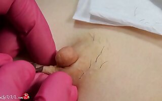 Impoverish Beautician Plucks Hair on Nipples of Unfocused on Depilation together with Massaging Tits In Red Latex Gloves